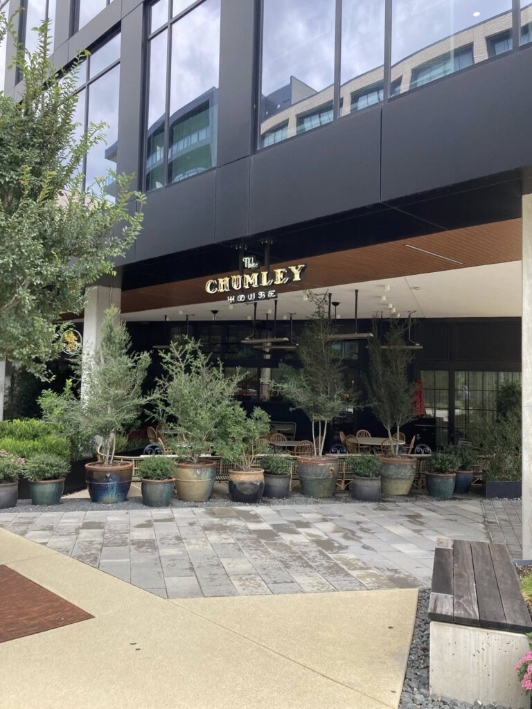 The patio at The Chumley House offers views of the nearby art museum and access to popular cocktails like the Il Comendatore (sazerac rye, caffe amaro, Aperol) and a classic gin martini made with London Dry Gin. (Courtesy)