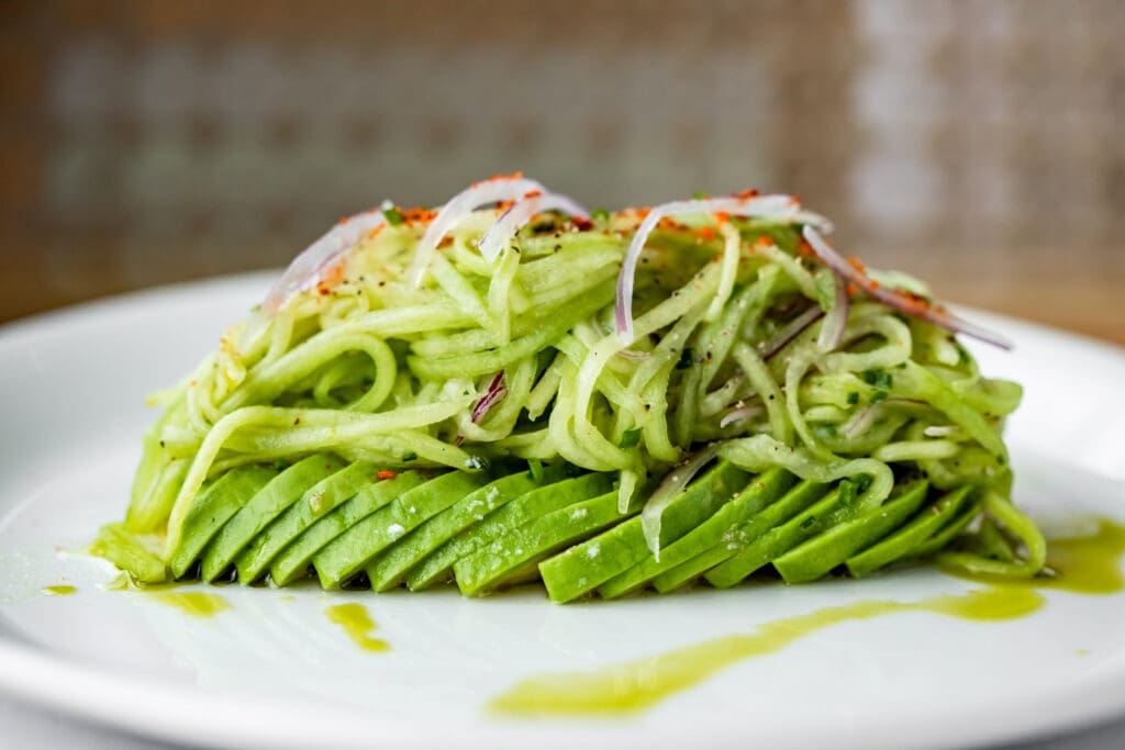 Don't miss the Avocado Cucumber Salad at Tavola.
