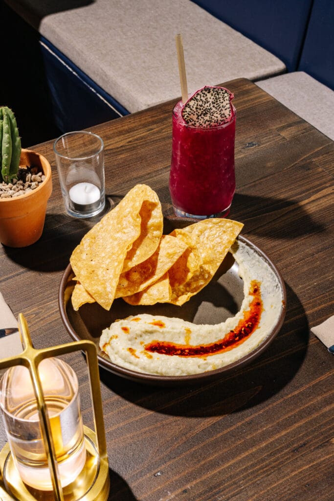 Starters at Far-Out include a roasted garlic white bean dip with house chili oil and tortilla chips for dipping. (Photo by Paul Torres Garcia at Sobremesa Studios)