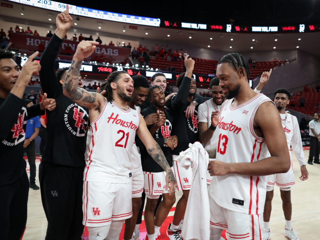 University of Houston guard Emanuel Sharp let a playful "One More Year!" chant for sixth year forward J'Wan Roberts. (Photo by F. Carter Smith)