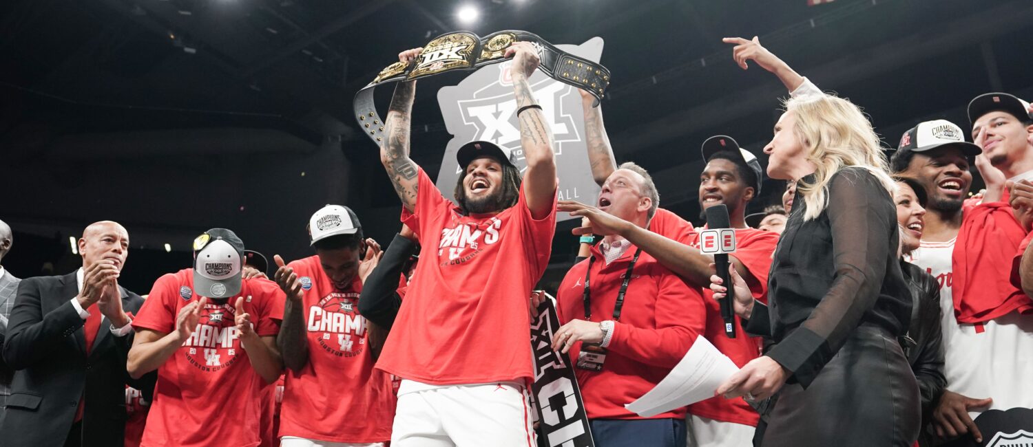 Emanuel Sharp had some fun holding up the championship belt for winning Big 12 MOP. But its his health that’s the biggest thrill for Kellvin Sampson’s University of Houston team. (Photo by Denny Medley/Big 12 Conference)