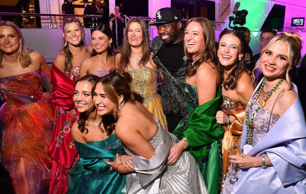 Knights of Momus duchesses with 50 Cent at Tilman Fertitta's super yacht The Boardwalk. (Photo by Dave Rossman)