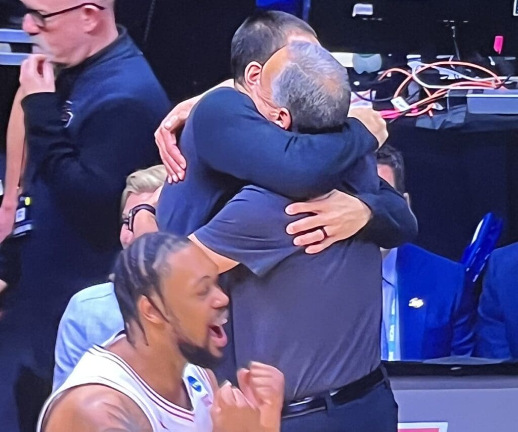 Kellen Sampson and Kelvin Sampson share a monster embrace after Houston earns another trip to the Final Four.
