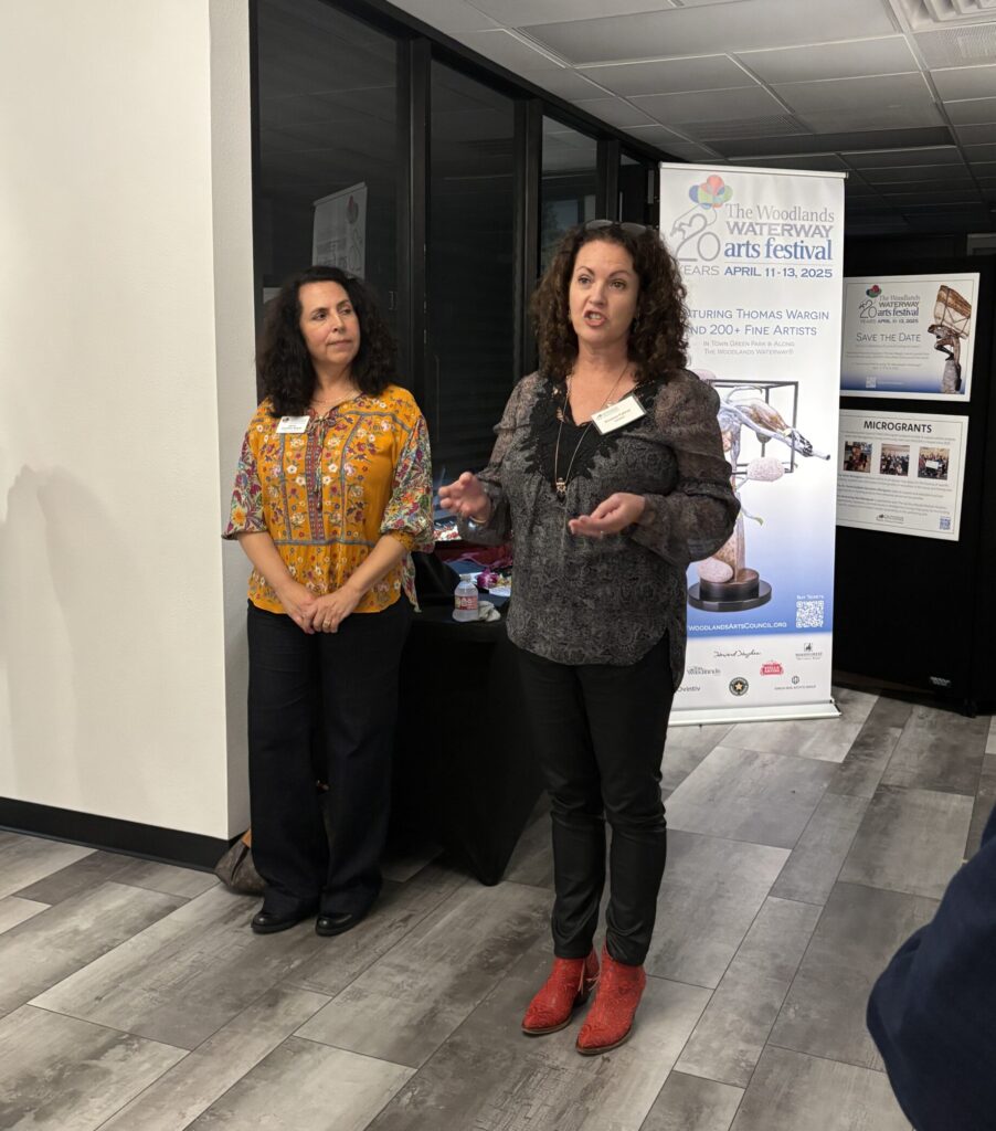 Curator Annette Palmer, right, explains the process of selecting pieces for the "Art Dash" exhibit at The Woodlands Arts Council gallery and office space. (Photo by Laura Landsbaum)