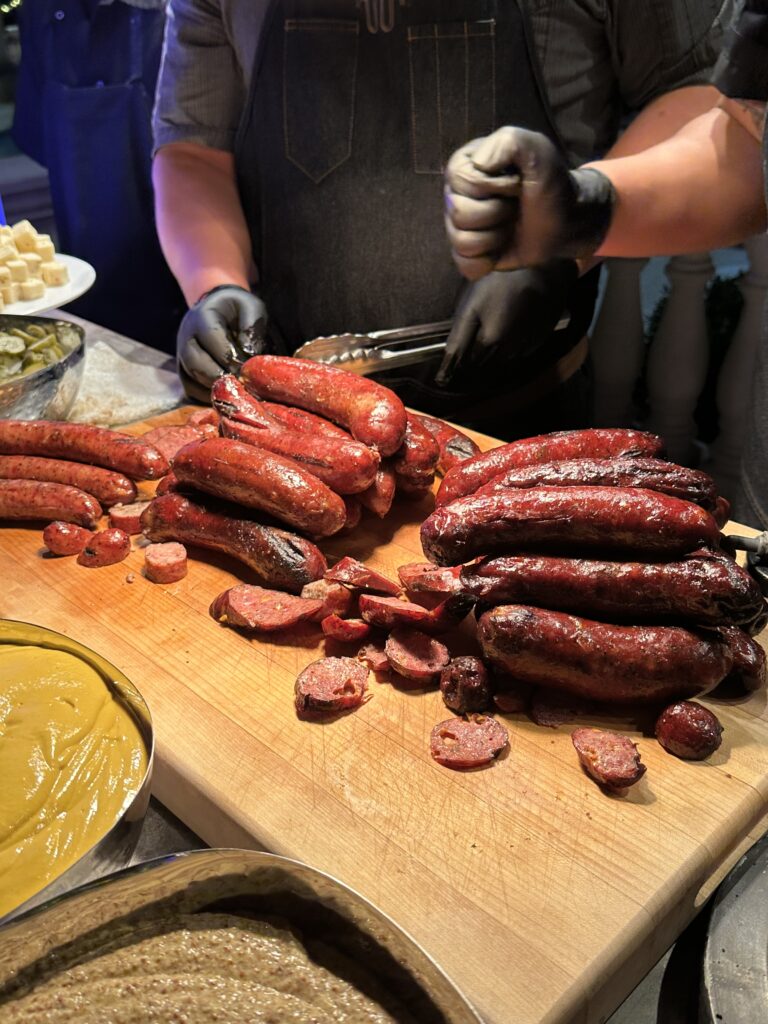 Sausage among the numerous dishes served at the Rockets Clutch City Foundation gala held on the grounds of the Fertitta family home in River Oaks. (Photo by Shelby Hodge)