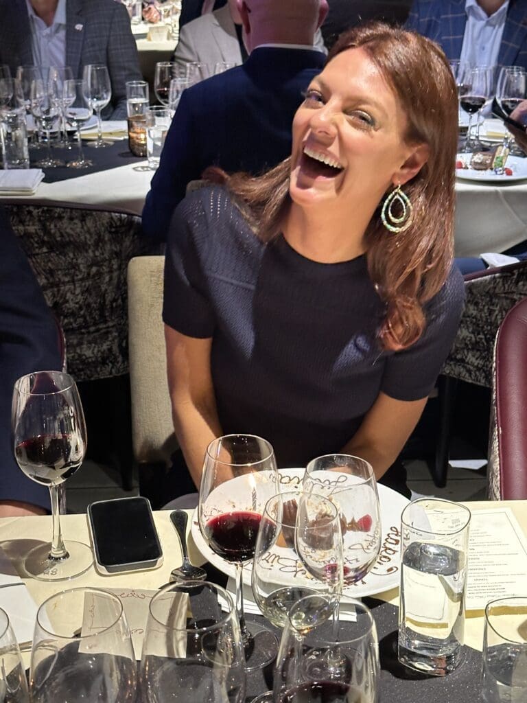 Julia Morales gets an early birthday surprise at the Aperture Cellars Wine Dinner hosted by the Jim Crane family. (Photo by Shelby Hodge)