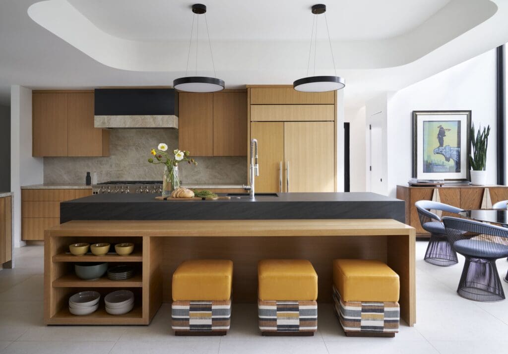 The renovated gourmet kitchen has  dual islands with seating and double ovens.  (Photo by Pär Bengtsson)