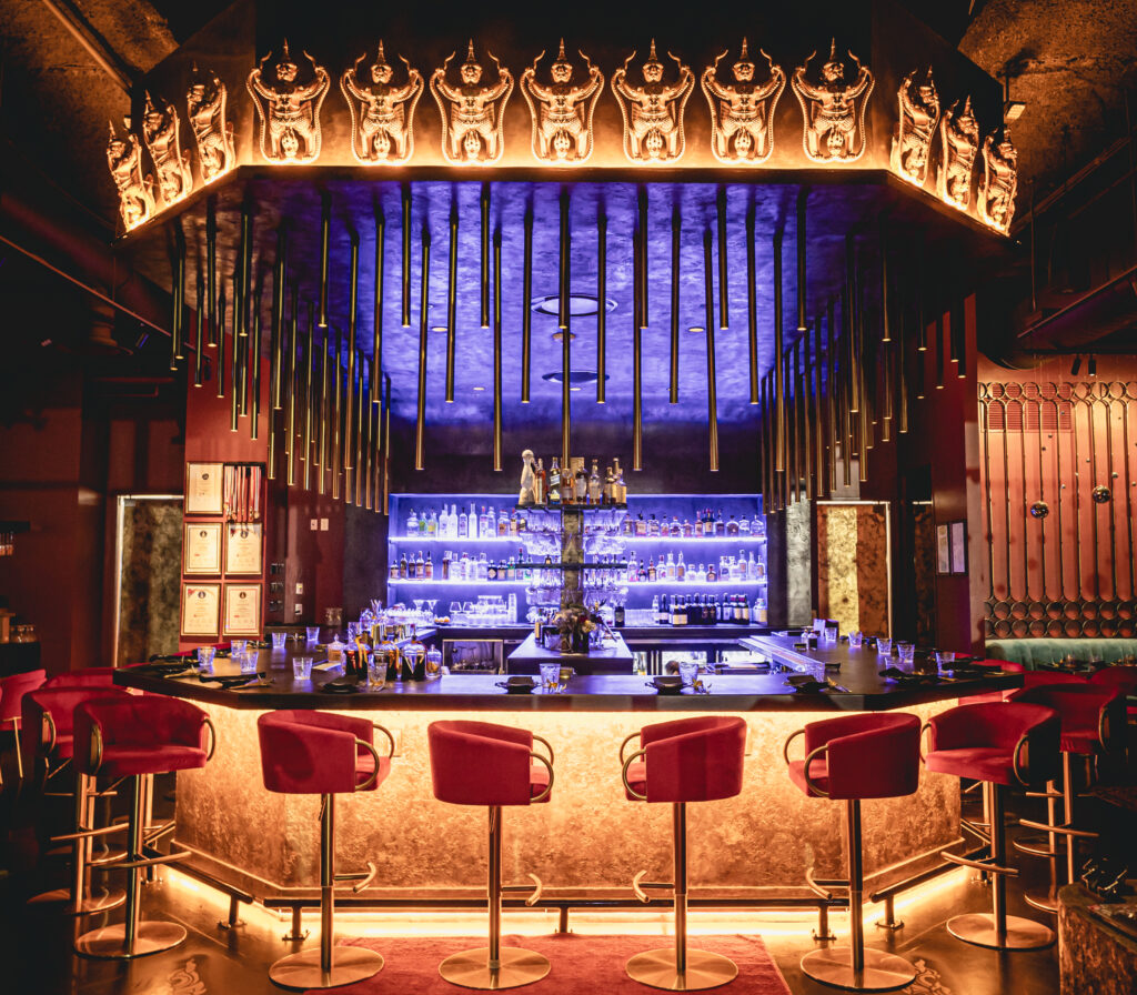 The ambiance of MaKiin is designed with a unique cultural touch, featuring rare Thai artifacts that are hard to find outside of Thailand, creating an unforgettable dining atmosphere.