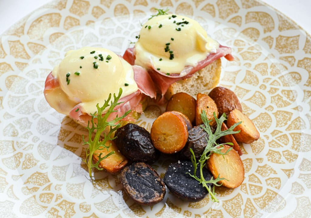 Guests can expect dishes like Prosciutto Eggs Benedict at Tavola's brunch.