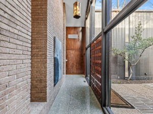 The entryway showcases the best of midcentury modern design. (Photo by Compass RE Texas)