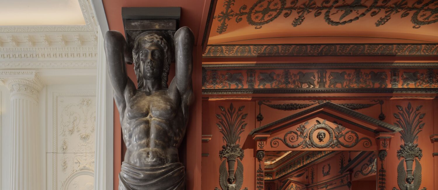 In the vestibule of Féau Boiseries headquarters in Paris, the elaborate hand- carved Etruscan-style rooms were inspired by the original neoclassical decor designed for Napoleon by architects Charles Perrier and Pierre-François Fontaine.