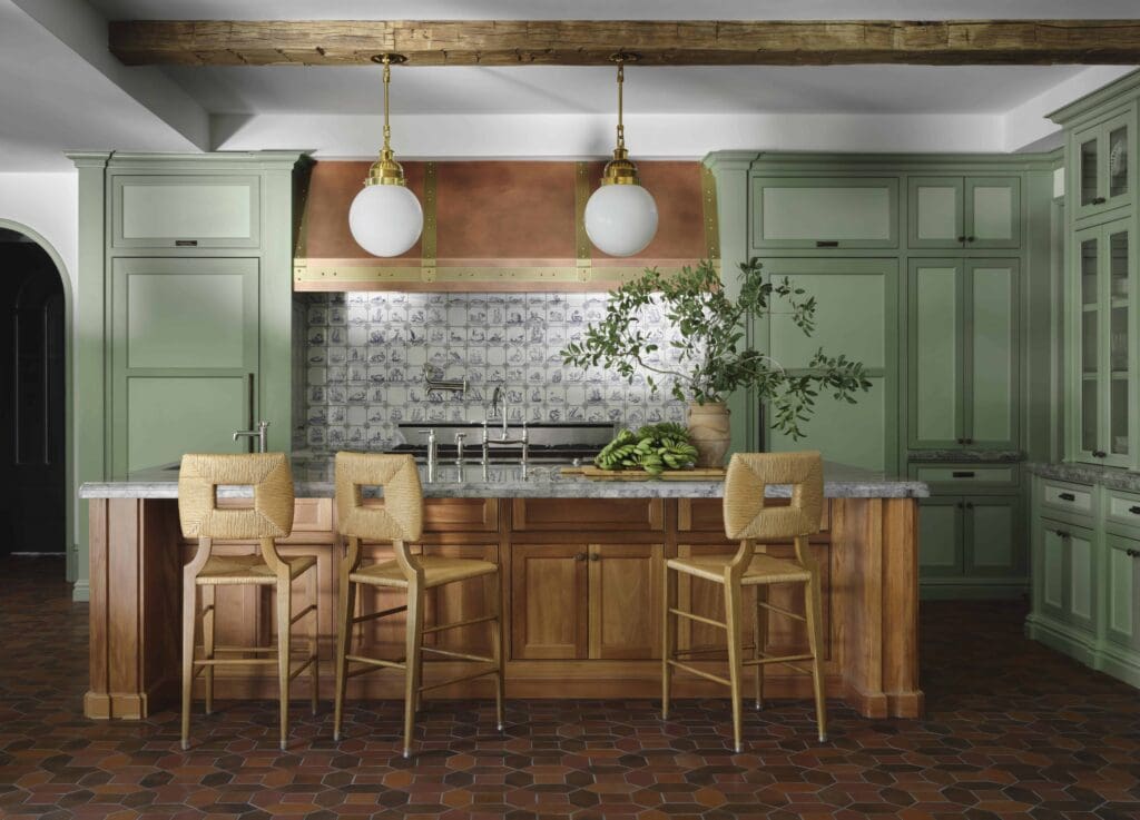 Delft-style kitchen tiles were custom-made in the Netherlands. Urban Electric Co. pendant lights. Farrow & Ball Calke Green on cabinets.  (Photo by Douglas Friedman)