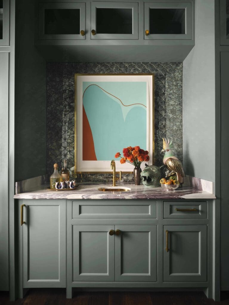 The bar area is painted Farrow & Ball Oval Room Blue. Virginia Jaramillo painting. (Photo by Douglas Friedman)