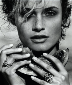 Amber Valletta wearing Rio Knot and Noblesse rings, St. Barts, 2001. (Photo by Peter Lindbergh)