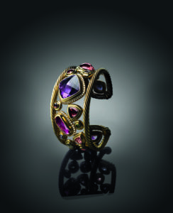 25th Anniversary Mosaic cuff with garnet, pink tourmaline, peridot, and pavé-set diamonds, 2011. (Photo by Raymond Meier)