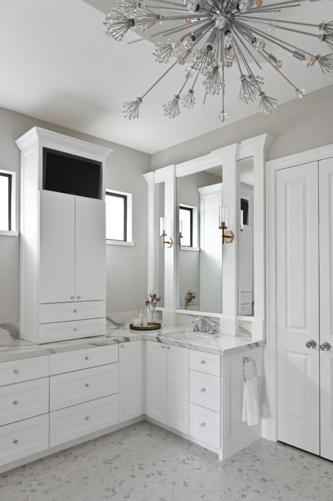The entirely new primary bath is thoughtfully designed with abundant storage. (Photo by Charbonneau Interiors)