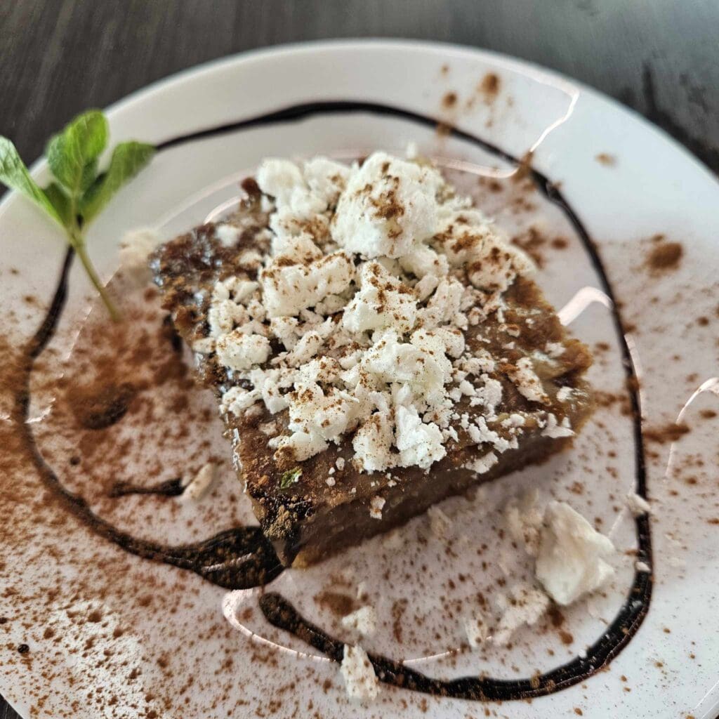 The Malva pudding at Karino's is warm, creamy, and drenched in sweet sauce. (Photo by Edward Brown)