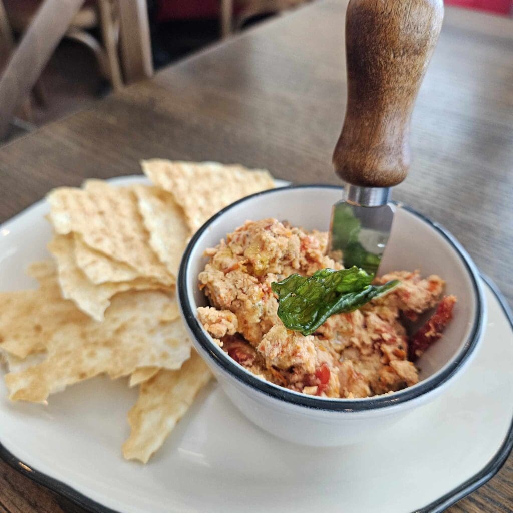 One delightful Margie's Italian Gardens opener, the Italian Cracker, comes with sun-dried tomato mascarpone for a bright, savory bite. (Photo by Edward Brown)