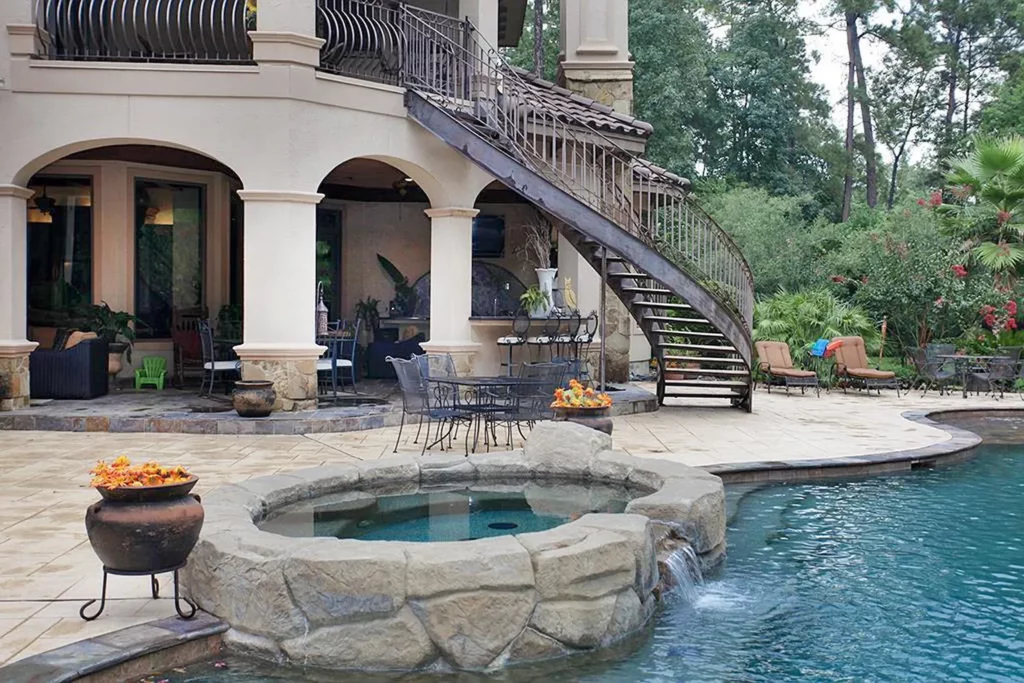 The stunning pool and spa at 23 Villeroy Way is the perfect anchor for the outdoor oasis. 