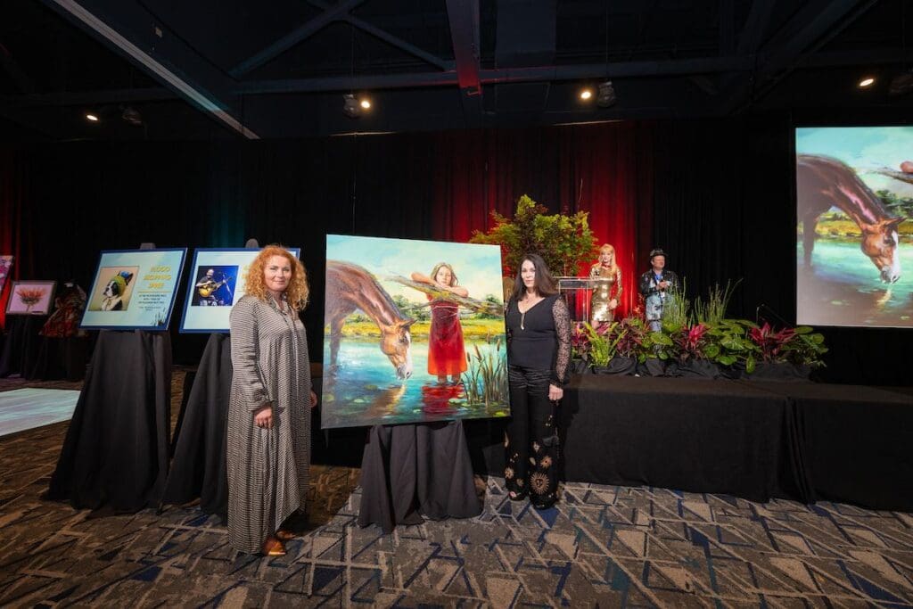 Art lovers pause for a closer look during the fast-paced fun of the 2024 Art Dash party. (Photo courtesy The Woodlands Arts Council)