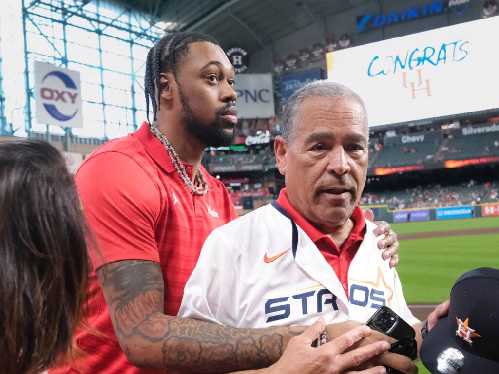 University of Houston coach Kelvin Sampson and J'Wan Roberts have a beyond special bond that was shown by Sampson bringing Roberts out with him for the first pitch at the Astros game. (Photo by F. Carter Smith)