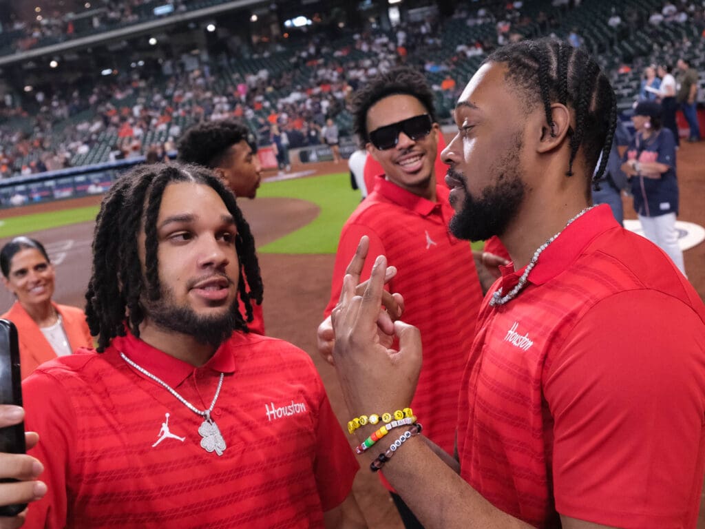 University of Houston players Emanuel Sharp, Ramon Walker Jr. and J'Wan Roberts are close. (Photo by F. Carter Smith)