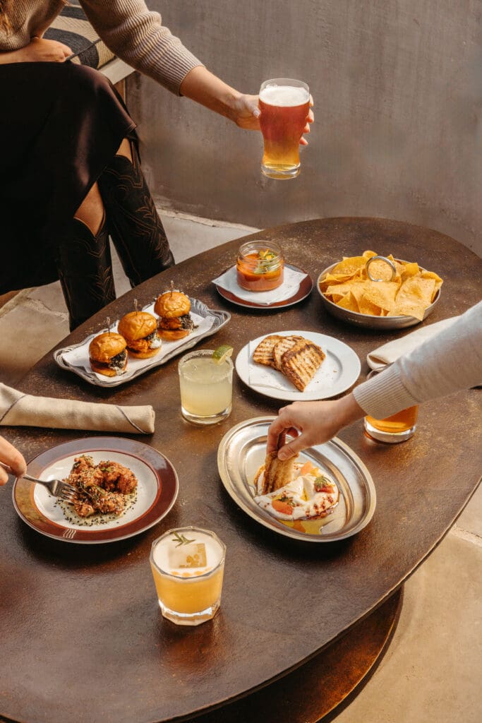 From the walk-in-only menu, try the Whipped Feta Toast with harissa and Medjool date, or the Fire Roasted Corn topped with chermoula, Aleppo, and crumbled feta. (Courtesy)