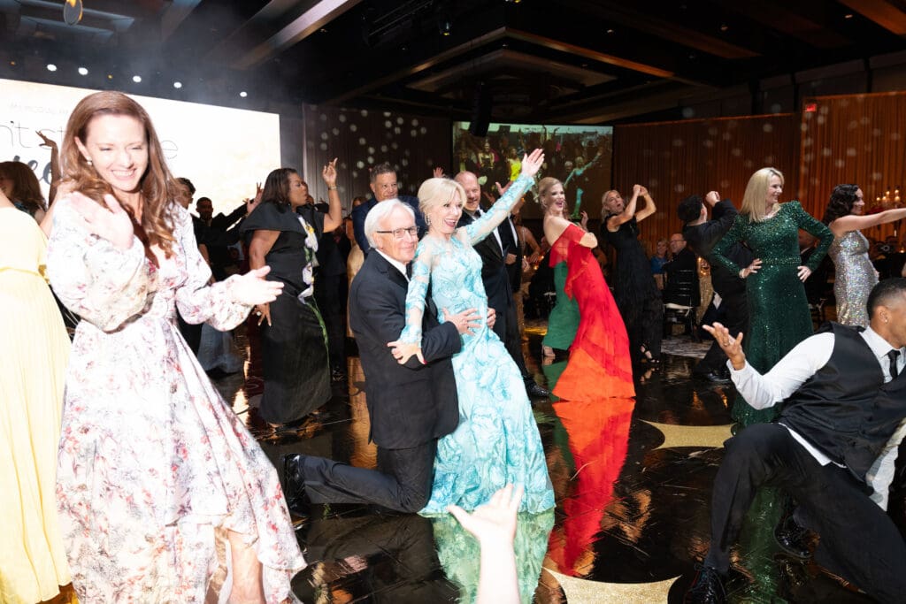 Bill King & Cheryl Boblitt King join the flash mob dance at the Memorial Hermann Foundation gala (Photo by Daniel Ortiz)