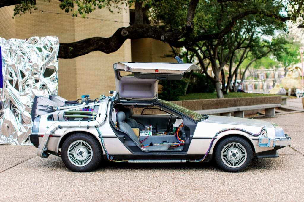 A DeLorean parked in front of the Musical Hall at Fair Park (Photo by nbarrett photography)