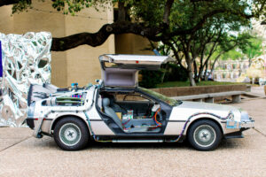 A DeLorean parked in front of the Musical Hall at Fair Park (Photo by nbarrett photography)