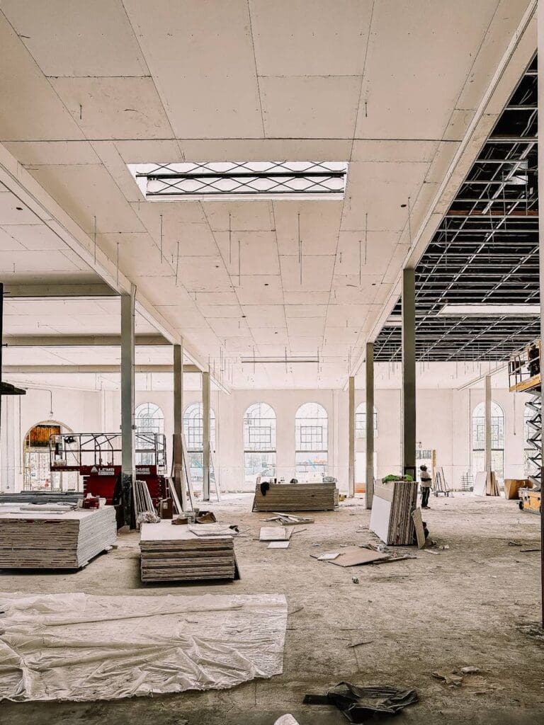 Workers continue the transformation of the historic Fort Worth Public Market, where new dining, lounge, and café concepts will bring fresh life to the landmark this fall. (Courtesy)