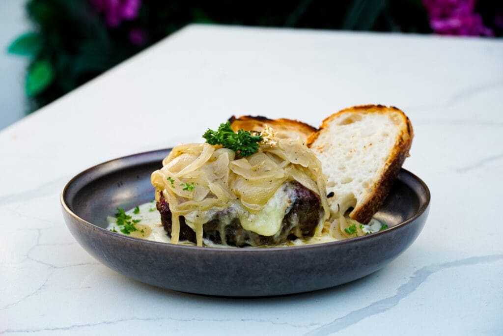 Open for lunch, dinner, and weekend brunch (including a Sunday Drag brunch) membership is not required to secure a table. Shown above, scratch made French onion soup. (Photo by Photos by Becca DeFillippo)