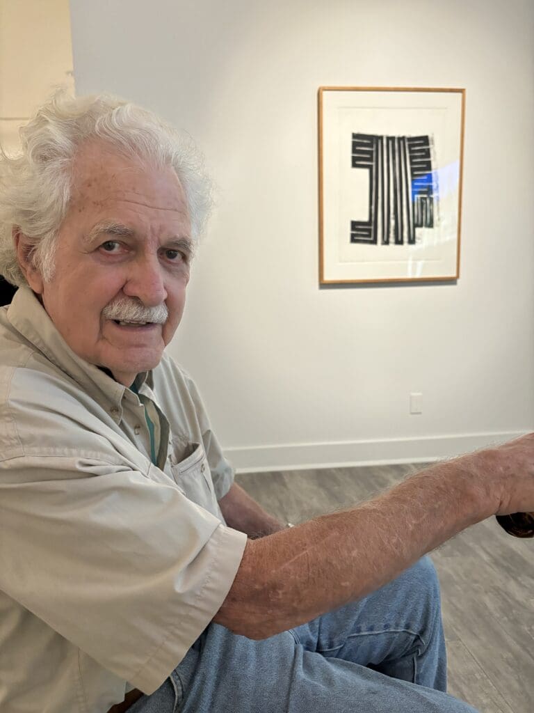 Artist Mac Whitney attended the opening of his exhibit at Andrew Durham Gallery in December 2024. (Photo by Ericka Schiche)