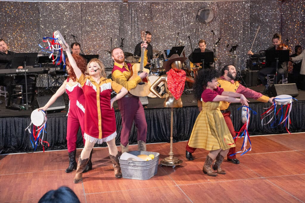 The 'Das Barbecü' cast provides a lively interlude during Stages' 'Rhinestone Cowboys & Golden Vikings' gala (Photo by Wilson Parish)