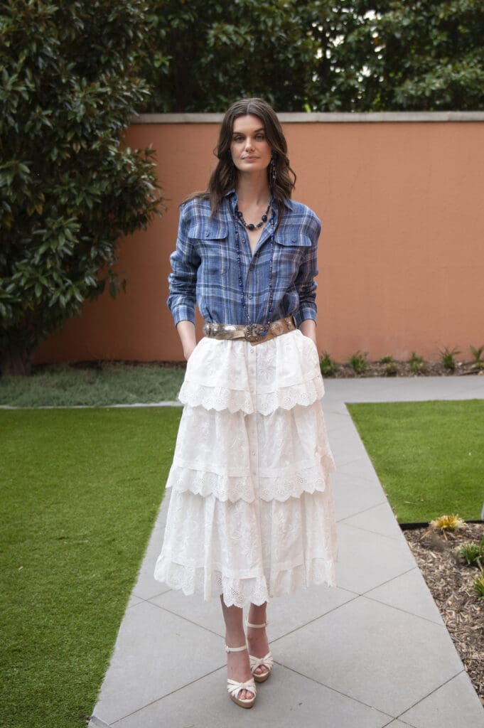 If I could choose one piece from the collection, I'd select the Caitlin Tiered Embroidered Cotton Poplin Midi Skirt ($2,990) for its timeless versatility. (Photo by Tamytha Cameron)