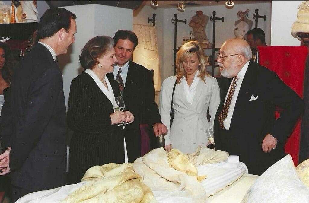 Crawford Brock, Caroline Rose Hunt, David Sands, a party guest, and Stanley Marcus attend the opening of the Pratesi shop at Stanley Korshak in the 1990s. (Courtesy)