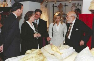 Crawford Brock, Caroline Rose Hunt, David Sands, a party guest, and Stanley Marcus attend the opening of the Pratesi Linen shop in the 1990s. (Courtesy)