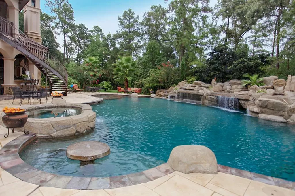 The stone landscaping is the perfect complement to the pool at 23 Villeroy Way. 