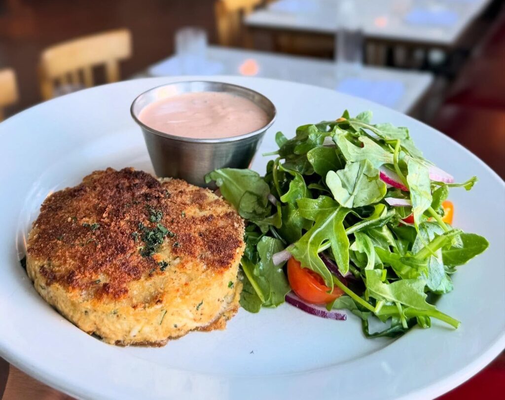 Coastal classics like lobster rolls and seared redfish are served in the historic LaCava Building that now houses Walloon's Restaurant. (Courtesy)
