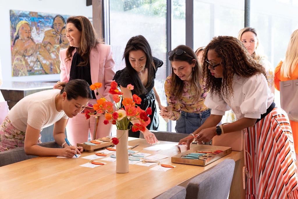 Leatherology was onsite customizing leather keychains that featured Madeline Donahue's artwork with guests' monograms. (Photo by Kaitlin Saragusa Photography)