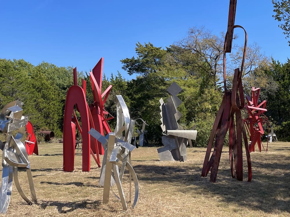 A sculpture field assembled by artist Mac Whitney, located on his parcel of land in Ovilla, Texas. (Photo by Susan Chadwick. Courtesy Andrew Durham Gallery, Houston)