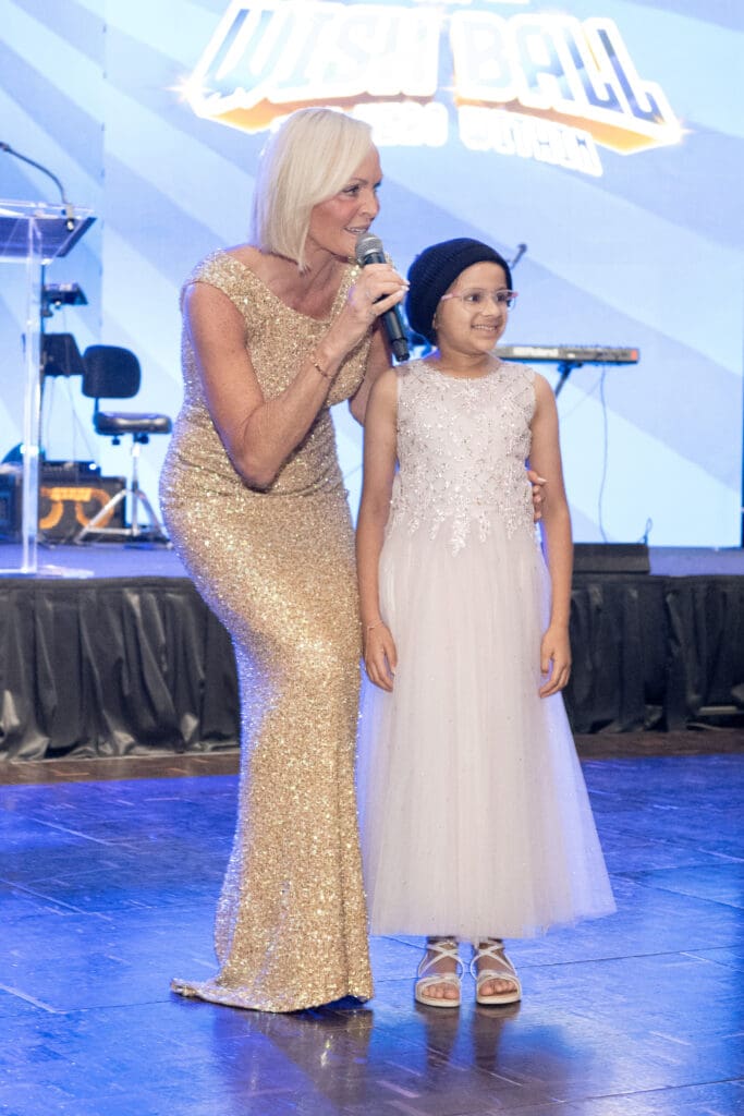 Make-A-Wish recipient, Aria Momin, who wished to plant 1,000 trees with Auctiontainer Leticia Frye (Photo by Jacob Power)