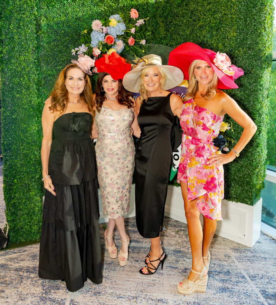 The TWHS Township's Cindy Heiser (left) and friends embraced the Kentucky Derby theme for Habitat for Humanity.