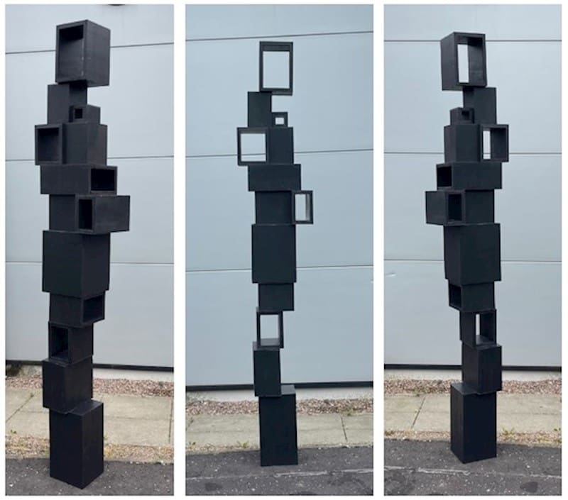Brendan Jamison's metal abstract cube sculptures are on display.