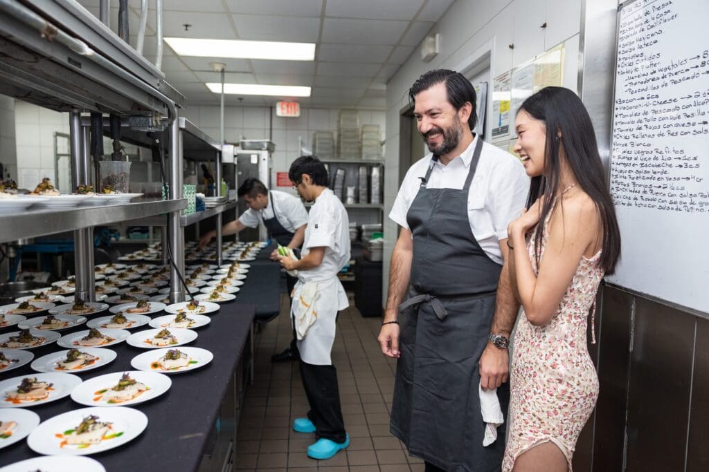 Chef Aaron Bludorn, soloist Danbi Kim admiring their culinary creation at Houston Ballet's 'Raising the Barre' dinner (Photo by Melissa Taylor)