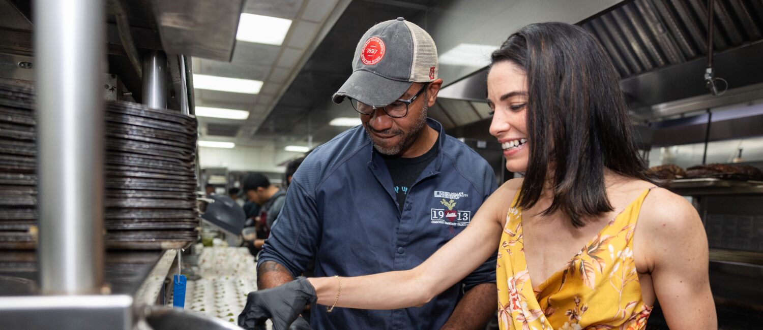 Chef Chris Williams and Estheysis Menendez put finishing touches on their dish; Photo Credit Melissa Taylor.jpg (Photo by Melissa Taylor)