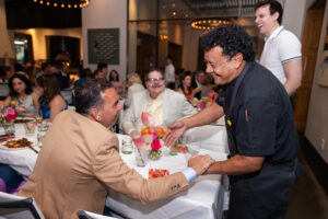 Chef Hugo Ortega and Chase O’Connell mingle with attendees; Photo Credit Melissa Taylor (Photo by Melissa Taylor)