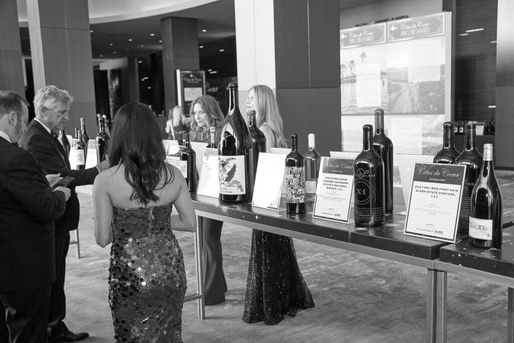 Guests viewed the robust wine auction (Photo by Nate Rehlander)