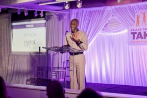 Hamilton A Sneed welcomes guests (Photo by Thomas Garza and Tamytha Cameron)