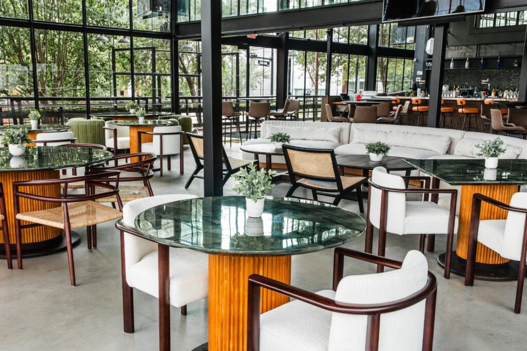 After a rousing game, head to the bar area, where you can lounge on cozy sofas or take a seat at a communal table and huddle with other players over a cherry pop spritz made with citrus-scented vodka, cherry aperitivo, lime, and tart cherries with a topper of sparkling cava. (Photo by Photos by Becca Wright)